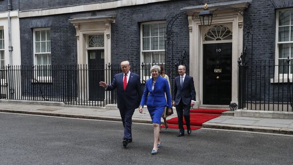Britain's Prime Minister Theresa May, her husband Philip May, right, President Donald Trump and first lady Melania Trump, second right, walk from 10 Downing Street to the Foreign Office for a joint press conference in central London, Tuesday, June 4, 2019 - Sputnik International