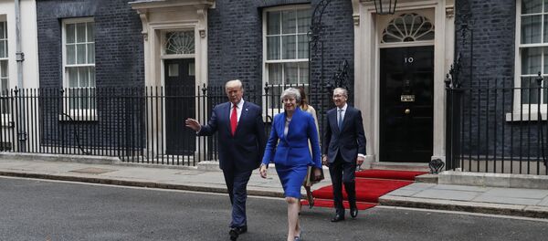 Britain's Prime Minister Theresa May, her husband Philip May, right, President Donald Trump and first lady Melania Trump, second right, walk from 10 Downing Street to the Foreign Office for a joint press conference in central London, Tuesday, June 4, 2019 - Sputnik International