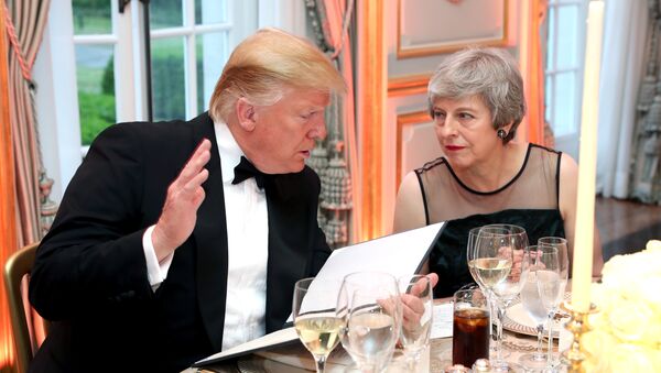 U.S. President Donald Trump and British Prime Minister Theresa May speak at a dinner hosted by himself and first lady Melania Trump at Winfield House, during their state visit in London, Britain June 4, 2019 - Sputnik International