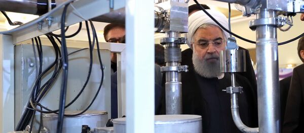 Hassan Rouhani on April 9, 2018 shows him (C) during a ceremony to mark National Nuclear Technology Day in Tehran Hassan Rouhani on April 9, 2018 shows him (C) during a ceremony to mark National Nuclear Technology Day in Tehran - Sputnik International