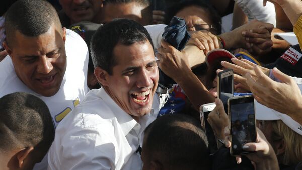Venezuela's opposition leader and self-proclaimed interim president Juan Guaido greets supporters during a rally in Barinas, Venezuela, Saturday, June 1, 2019. Guaido is taking his campaign to oust President Nicolas Maduro to the birthplace of Hugo Chavez, the socialist leaders's mentor - Sputnik International