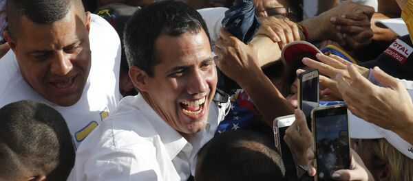 Venezuela's opposition leader and self-proclaimed interim president Juan Guaido greets supporters during a rally in Barinas, Venezuela, Saturday, June 1, 2019. Guaido is taking his campaign to oust President Nicolas Maduro to the birthplace of Hugo Chavez, the socialist leaders's mentor Venezuela's opposition leader and self-proclaimed interim president Juan Guaido greets supporters during a rally in Barinas, Venezuela, Saturday, June 1, 2019. Guaido is taking his campaign to oust President Nicolas Maduro to the birthplace of Hugo Chavez, the socialist leaders's mentor - Sputnik International