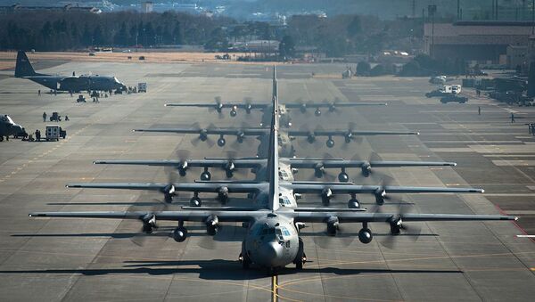 Six U.S. Air Force C-130 Hercules aircraft assigned to the 374th Airlift Wing line up before flying during a readiness week Feb. 21, 2013, at Yokota Air Base, Japan - Sputnik International