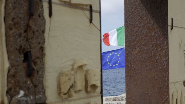 The European and the Italian flags wave behind the Door of Europe monument in the Sicilian island of Lampedusa - Sputnik International