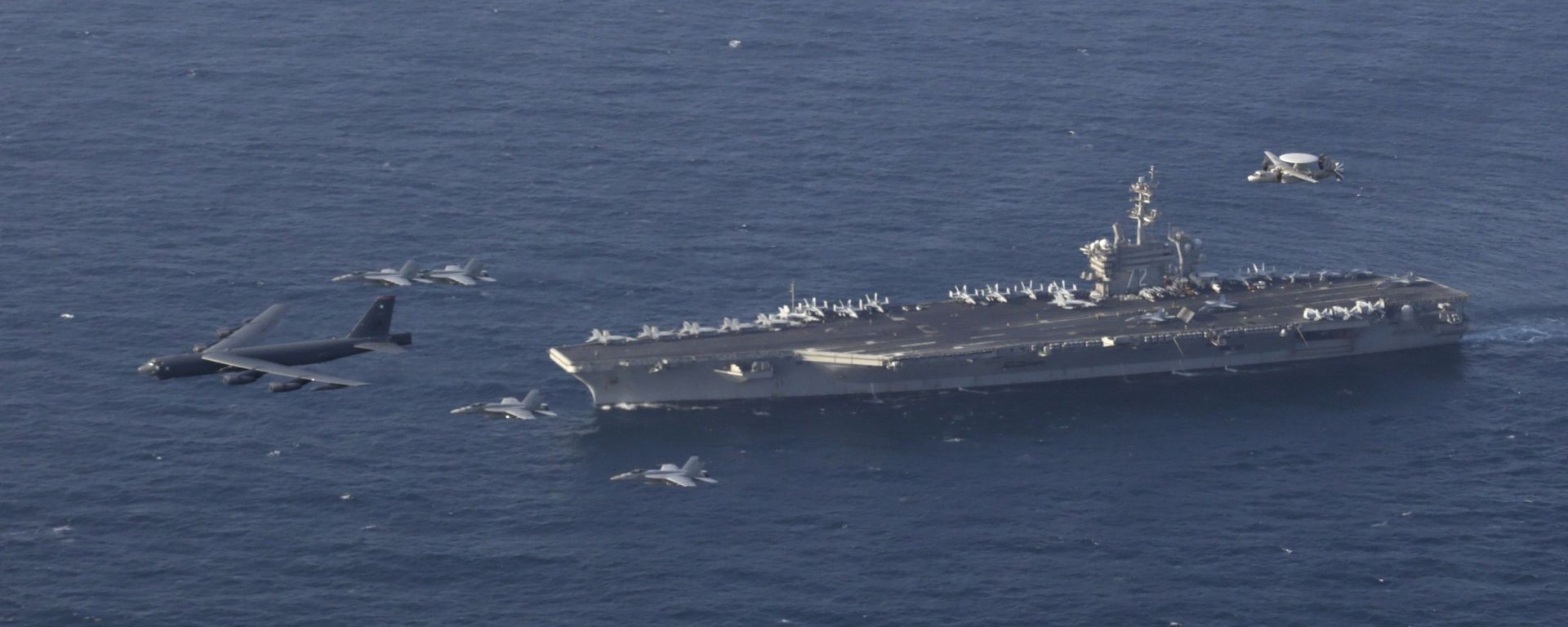 June 1, 2019 file photo, the USS Abraham Lincoln carrier and a U.S. Air Force B-52H Stratofortress, conduct joint exercises in the U.S. Central Command area of responsibility in Arabian sea - Sputnik International, 1920, 17.08.2026