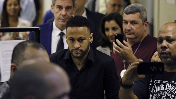Brazilian soccer player Neymar leaves police headquarters in Rio de Janeiro, Brazil, Thursday, June 6, 2019. Neymar went to the headquarters in an investigation linked to a woman’s rape allegation against him - Sputnik International