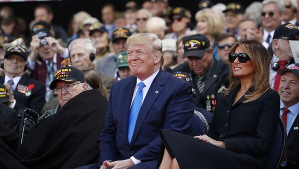 President Donald Trump and first lady Melania Trump, participate in a ceremony to commemorate the 75th anniversary of D-Day at the American Normandy cemetery, Thursday, June 6, 2019, in Colleville-sur-Mer, Normandy, France. - Sputnik International