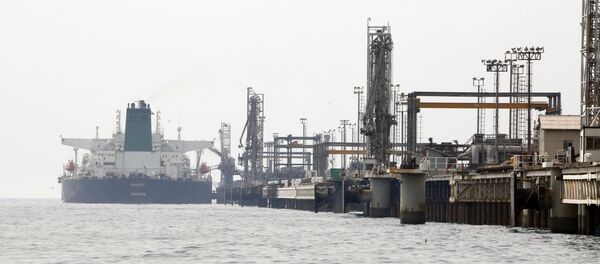 A picture taken on March 12, 2017, shows an Iranian tanker docking at the platform of the oil facility in the Khark Island, on the shore of the Gulf.  - Sputnik International