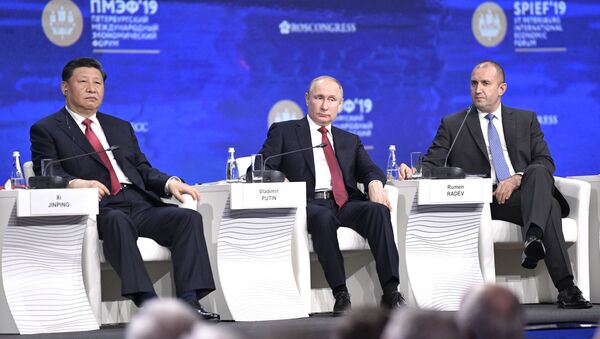 Russian President Vladimir Putin, Chinese President Xi Jinping and President of Bulgaria Rumen Radev on the SPIEF 2019  - Sputnik International