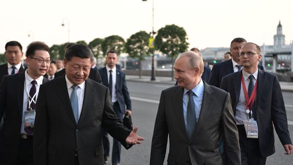 Vladimir Putin, Xi Jinping at SPIEF - Sputnik International