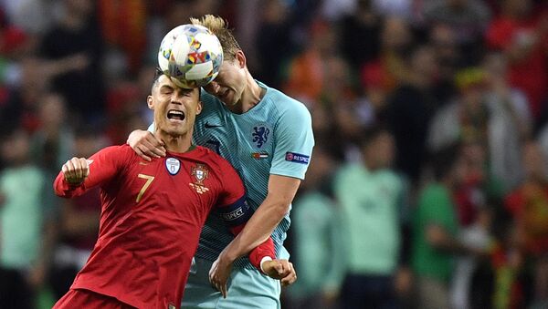 Portugal's Cristiano Ronaldo, left, jumps for the ball with Netherlands' Matthijs de Ligt during the UEFA Nations League final soccer match between Portugal and Netherlands at the Dragao stadium in Porto, Portugal, Sunday, June 9, 2019. - Sputnik International