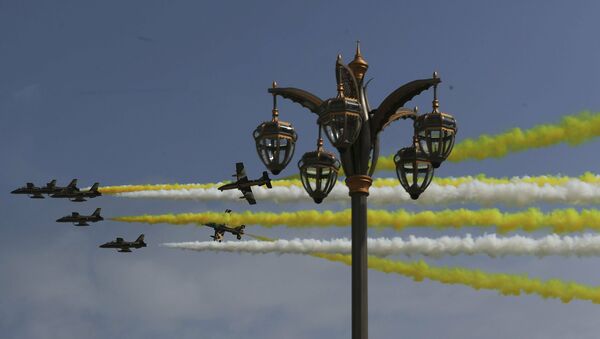 Al Fursan, or the Knights, a UAE Air Force aerobatic display team, perform as they make the colors of the Vatican flag ahead of Pope Francis arrival at the Abu Dhabi Presidential Palace, United Arab Emirates, Monday, Feb. 4, 2019 - Sputnik International