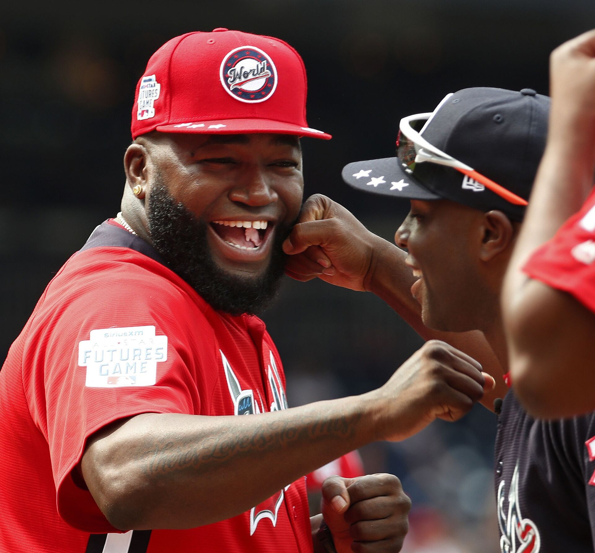 In this July 15, 2018, file photo, World Team Manager David Ortiz (34) speaks with U.S. Team Manager Torrii Hunter, before the All-Star Futures baseball game at Nationals Park, in Washington. Ortiz returned to Boston for medical care after being shot in a bar Sunday, June 9, 2019, in his native Dominican Republic.  - Sputnik International, 1920, 24.09.2021