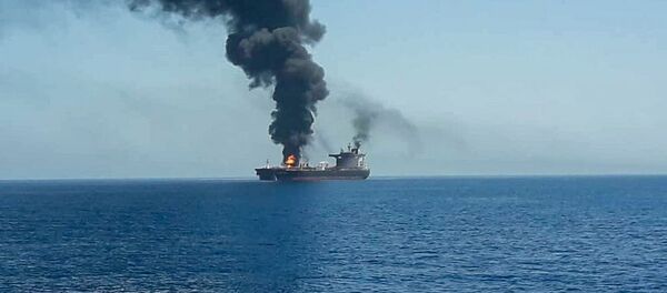 An oil tanker is seen after it was attacked at the Gulf of Oman, in waters between Gulf Arab states and Iran, June 13, 2019 - Sputnik International