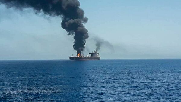 An oil tanker is seen after it was attacked at the Gulf of Oman, in waters between Gulf Arab states and Iran, June 13, 2019 - Sputnik International