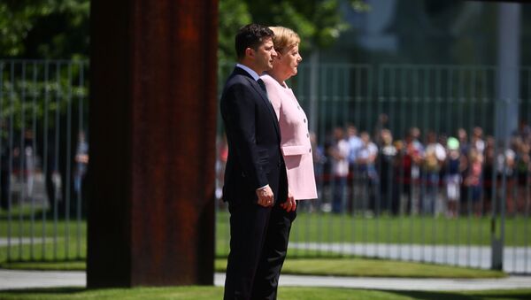 German Chancellor Angela Merkel and Ukrainian President Volodymyr Zelenskiy listen national anthems at the Chancellery in Berlin, Germany, June 18, 2019 - Sputnik International