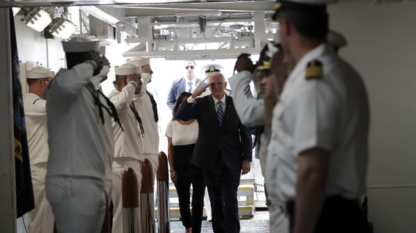 Vice President Mike Pence salutes as he arrives for a tour on the USNS Comfort, Tuesday, June 18, 2019, in Miami. The hospital ship is scheduled to embark on a five-month medical assistance mission to Latin America and the Caribbean, including several countries struggling to absorb migrants from crisis-wracked Venezuela. (AP Photo/Lynne Sladky) - Sputnik International
