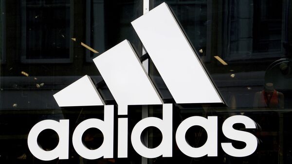 The logo of the sports goods manufacturer 'adidas' is pictured in Berlin, Germany, Monday, May 6, 2019 - Sputnik International