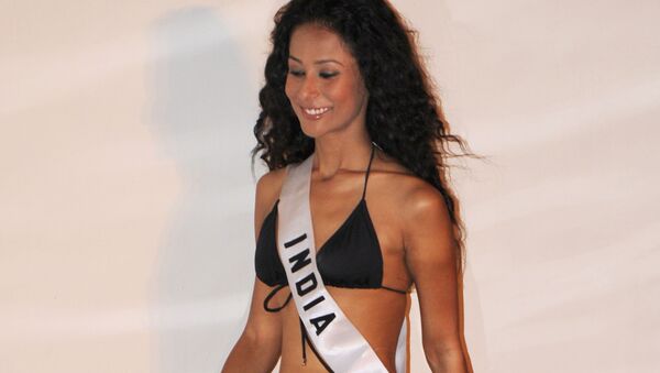 Miss India Ushoshi Sengupta poses for photographers during the Miss Universe 2010 Contestant Swimsuit Event at the Mandalay Bay Hotel in Las Vegas on August 21, 2010 - Sputnik International