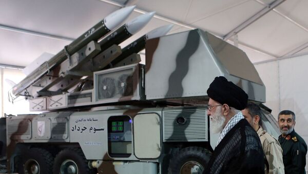 Iran's Supreme Leader Ayatollah Ali Khamenei is seen near a 3 Khordad system which is said to had been used to shoot down a U.S. military drone - Sputnik International