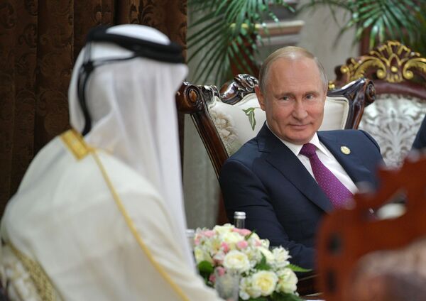 Russian President Vladimir Putin and Emir of Qatar Tamim bin Hamad Al Thani - Sputnik International
