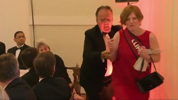 Footage shows foreign office minister Mark Field MP removing a protestor from the Mansion House dinner earlier this evening - Sputnik International
