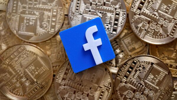 A 3-D printed Facebook logo is seen on representations of the Bitcoin virtual currency in this illustration picture, June 18, 2019 - Sputnik International