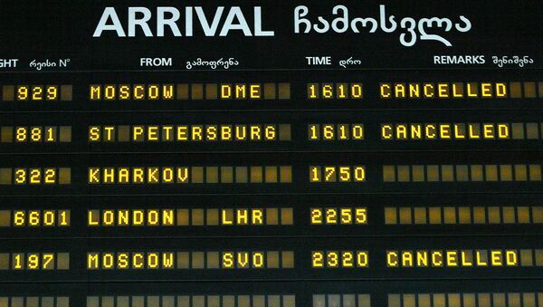 A view of an arrival-departure board with flights to Russia canceled seen at Tbilisi International airport - Sputnik International