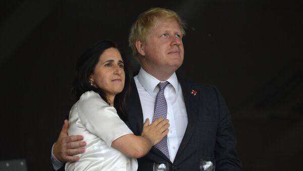 London's Mayor Boris Johnson (R) waits with his wife Marina Wheeler (L) prior to the start of the opening ceremony of the London 2012 Olympic Games on July 27, 2012 at the Olympic Stadium in London. - Sputnik International