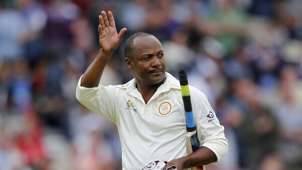 West Indies’ former player Brian Lara waves to the crowd after losing his wicket playing for the MCC (Marylebone Cricket Club) team during the Lord's bicentenary match between the MCC and Rest of the world at Lords Cricket ground in London on July 5, 2014 - Sputnik International
