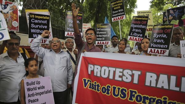 Activists of various left organizations denounce American policies while protesting against the upcoming visit of U.S. Secretary of State Mike Pompeo to India, in New Delhi, India, Tuesday, June 25, 2019. Pompeo is scheduled to travel to India after having visited Saudi Arabia and the United Arab Emirates, on a trip aimed at building a global coalition to counter Iran - Sputnik International