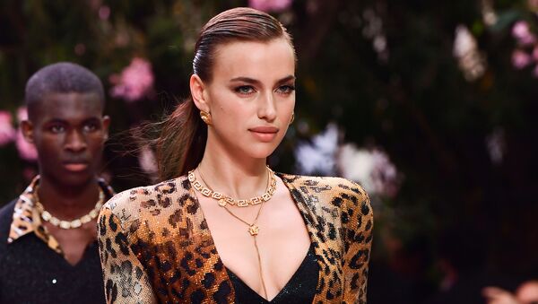 Russian model Irina Shayk presents a creation for fashion house Versace during the presentation of its women's and men's spring/summer 2020 fashion collection in Milan on June 15, 2019 - Sputnik International