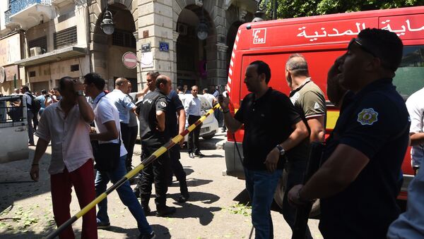 Tunisian security forces cordon off the site of an attack in the Tunisian capital's main avenue Habib Bourguiba on June 27, 2019. - Sputnik International