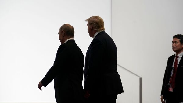 Russia's President Vladimir Putin and U.S. President Donald Trump walk during the G20 leaders summit in Osaka, Japan, June 28, 2019.   - Sputnik International
