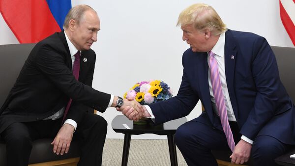 Russian President Vladimir Putin and U.S. President Donald Trump shake hands during a bilateral meeting at the at the Group of 20 (G20) leaders summit in Osaka, Japan. - Sputnik International