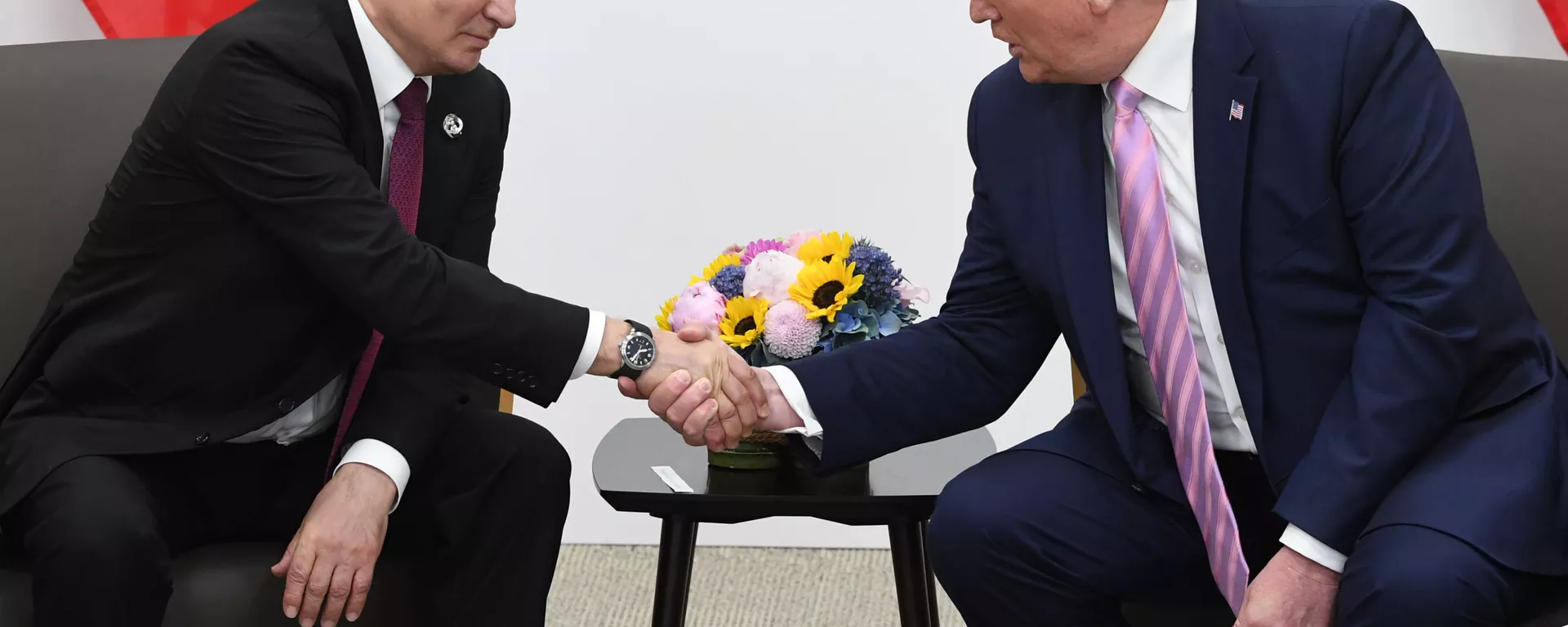 Russian President Vladimir Putin and U.S. President Donald Trump shake hands during a bilateral meeting at the at the Group of 20 (G20) leaders summit in Osaka, Japan. - Sputnik International, 1920, 22.12.2024