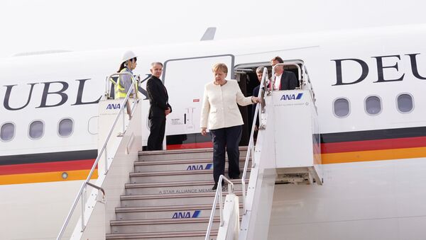 German Chancellor Angela Merkel arrives at Kansai international airport ahead of the start of the G20 leaders summit in Izumisano, Osaka prefecture, Japan, June 28, 2019 - Sputnik International