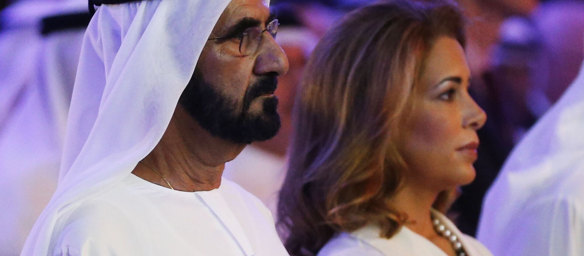 UAE Prime Minister and Dubai Ruler Sheikh Mohammed bin Rashid al-Maktoum (L) stands next to his wife Princess Haya bint al-Hussein during the presentation of a UN report on funding for humanitarian aid on January 17, 2016, in the Emirate of Dubai.  - Sputnik International, 1920, 29.06.2019