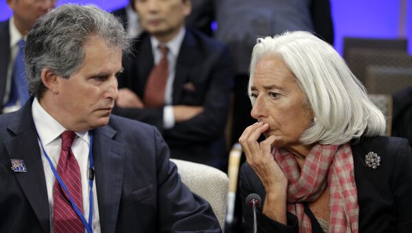 International Monetary Fund (IMF) Managing Director Christine Lagarde, right, speaks with First Deputy Managing Director of the International Monetary Fund, David Lipton - Sputnik International