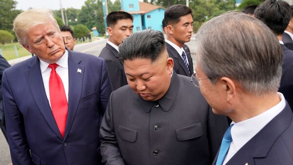 Trump meets with North Korean leader Kim Jong Un at the DMZ on the border of North and South Korea - Sputnik International