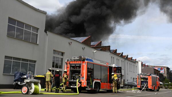Smoke rises over the the burning Dong Xuan Center, an Asian shopping centre in Berlin, Germany, July 4, 2019 - Sputnik International