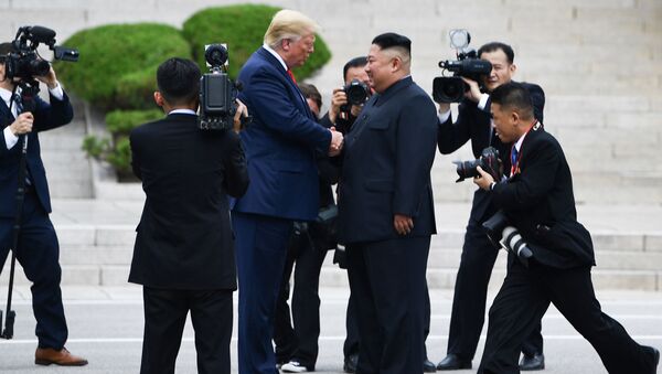 North Korean leader Kim Jong-un shakes hands with US President Donald Trump - Sputnik International