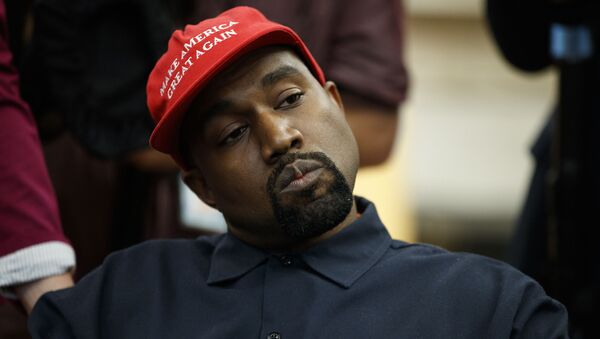 Rapper Kanye West listens to a question from a reporter during a meeting in the Oval Office of the White House with President Donald Trump, Thursday, Oct. 11, 2018, in Washington - Sputnik International