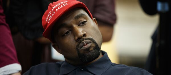 Rapper Kanye West listens to a question from a reporter during a meeting in the Oval Office of the White House with President Donald Trump, Thursday, Oct. 11, 2018, in Washington - Sputnik International