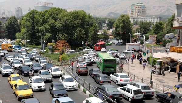 Cars drive through a busy road in the Iranian capital Tehran on July 3, 2019 - Sputnik International