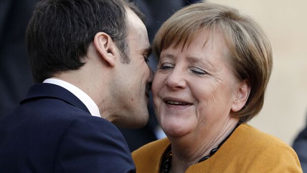 French President Emmanuel Macron Kisses German Chancellor Angela Merkel - Sputnik International