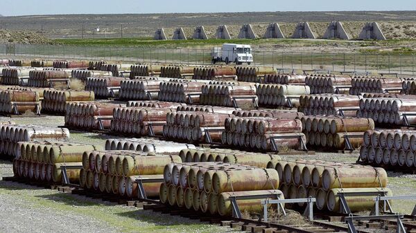 This April 30, 2001 file photo shows a safety vehicle passing a compound filled with 170-gallon containers of mustard and blister agent at the Deseret Chemical Depot in Tooele, Utah - Sputnik International