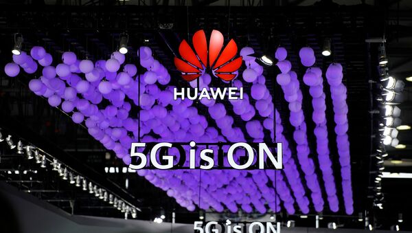 A Huawei logo and a 5G sign are pictured at Mobile World Congress (MWC) in Shanghai, China June 28, 2019 - Sputnik International