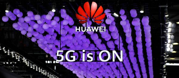 A Huawei logo and a 5G sign are pictured at Mobile World Congress (MWC) in Shanghai, China June 28, 2019 - Sputnik International