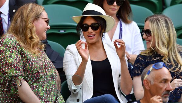 Britain's Meghan (C), Duchess of Sussex watches US player Serena Williams playing against Slovakia's Kaja Juvan during their women's singles second round match on the fourth day of the 2019 Wimbledon Championships at The All England Lawn Tennis Club in Wimbledon, southwest London, on July 4, 2019 - Sputnik International